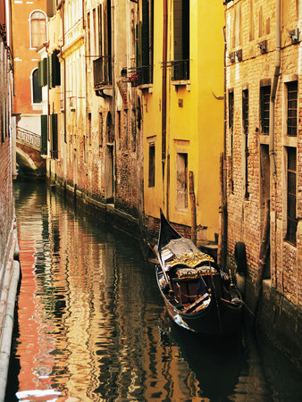 Typical venecian canal with gondola. Italy, Europe. の写真素材