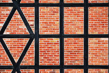 Details of the bricks wall with timber. Germany.の写真素材