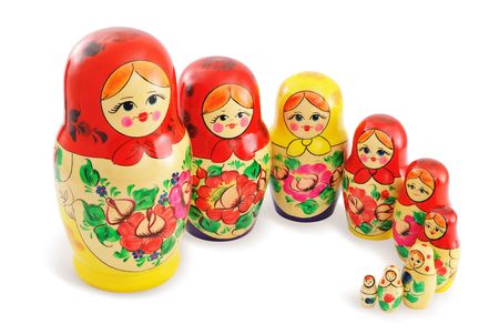 Traditional wooden Russian dolls arranged in group. Isolated on white background.の写真素材