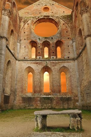 Abbazia di San Galgano. Tuscany, Italy. Famous abbacy without roof against dramatic sky.の写真素材