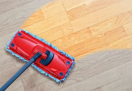 Housework - sweeper wet mop on laminate floors.の写真素材