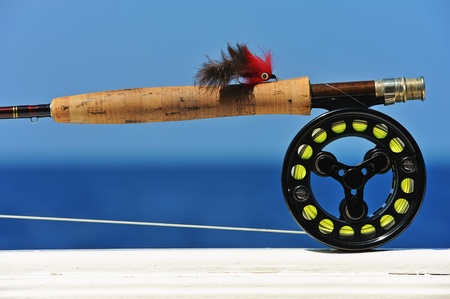 Close up shot of saltwater fly fishing tackle against seaの写真素材