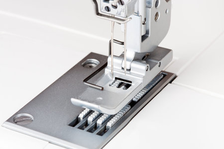 needles and foot of sewing machine