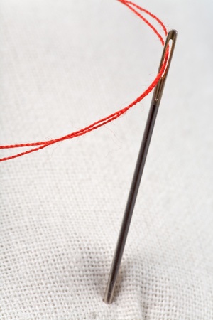 needle with red threadの写真素材