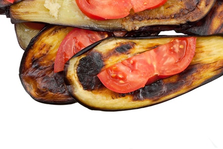 fried eggplants with fresh tomato isolated on whiteの写真素材