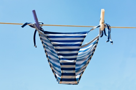 drying woman swimsuit outdoor in summer dayの写真素材