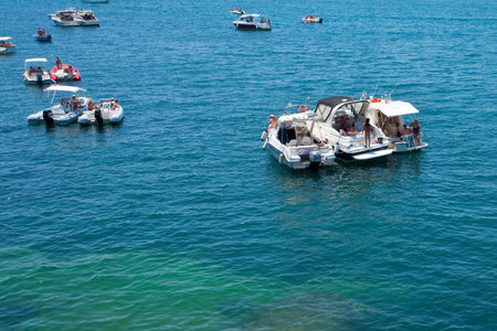 SYRACUSE, ITALY - JULY,3: there are not good beach in Syracuse, so people tan on yachts near urban...
