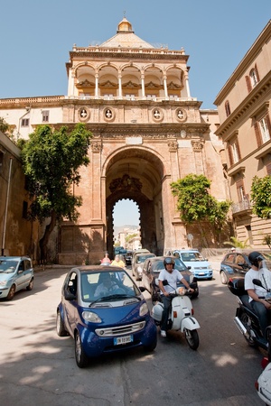 PALERMO, ITALY - JUNE, 24: traffic near Porta Nuova - historical medieval triumphal gateway in Palermo, Sicily on Lune 24, 2011のeditorial素材