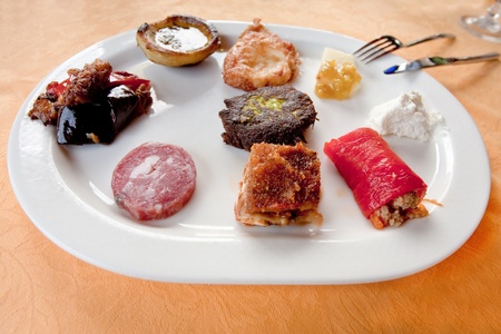 sicilian antipasti served in a restaurantの写真素材