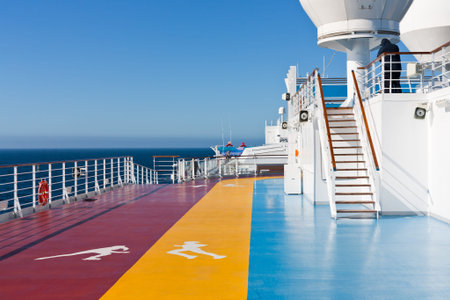 jogging tracks in recreation area on upper deck of cruise liner