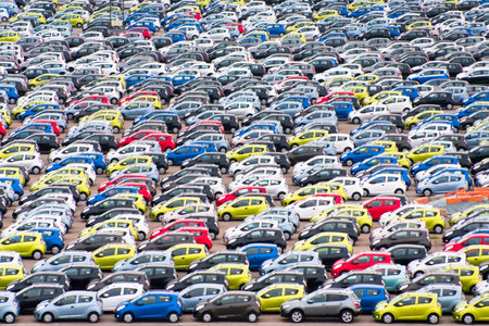 many small cars on outdoor parking in Copenhagen harbor 