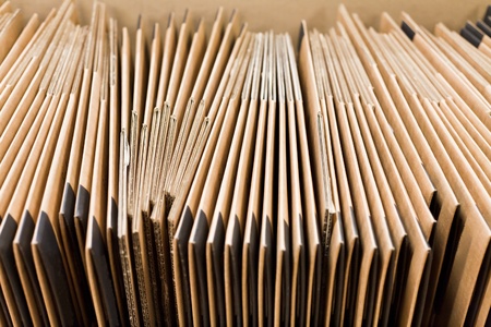 many non-assembled carton boxes in storage warehouse の写真素材