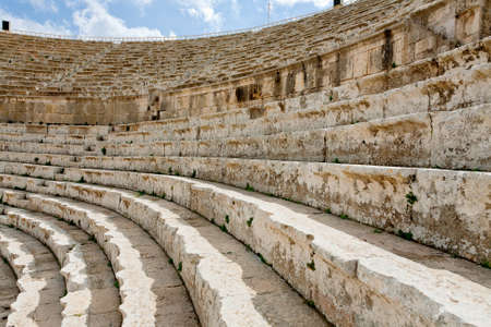 stone seats in antique Large South Theatre , Jerash in Jordanの写真素材