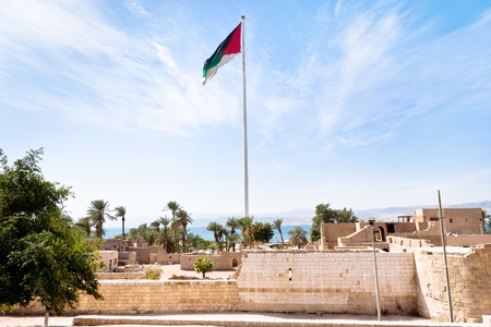 The Aqaba Flagpole under ruins of medieval Mamluks Aqaba fortの写真素材