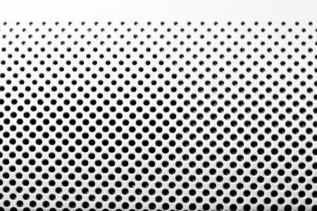 background from light metal plate with black holes