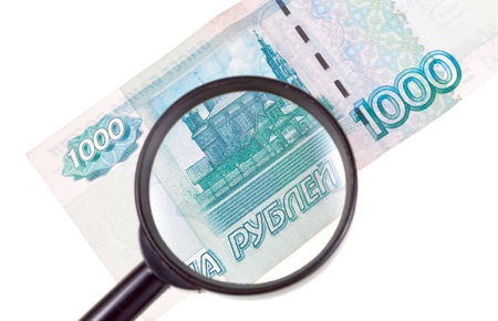 magnifying loupe enlarge banknote isolated on white backgroundの写真素材