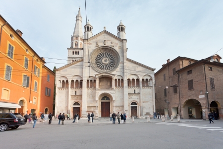 MODENA, ITALY - NOVEMBER 3: view of Corso Duomo and facade of Modena Cathedral. The present cathedral was consecrated by Pope Lucius III on July 12, 1184 in Modena, Italy on November 3, 2012のeditorial素材
