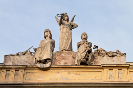 statue on roof of L' Arena del Sole - theater in Bologna , Italy in autumn morningの写真素材