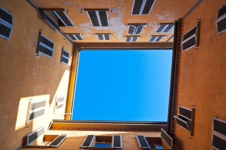 view on blue sky from Italian square urban yardの写真素材