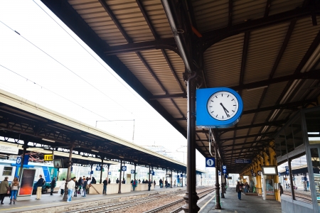 outdoor clock on railway platform at autumn dayのeditorial素材