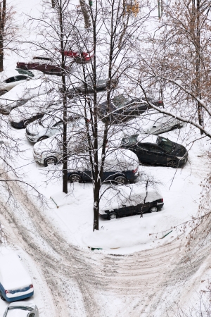 view of cars covered with snow on parking in Moscow, Russia in winter dayの写真素材
