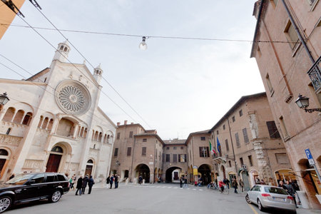 MODENA, ITALY - NOVEMBER 3: Corso Duomo and facade of Modena Cathedral. The present cathedral was...