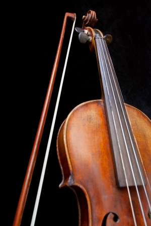 fiddle neck and bow on black background close upの写真素材