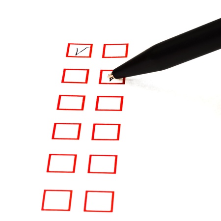 put tick in red square box by black ballpointの写真素材