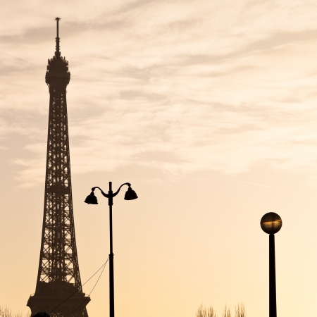 urban lantern and eiffel tower in Paris on yellow sunsetのeditorial素材