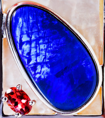 big blue opal and small pink tourmaline close up
