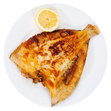 top view of fried sole fish on white plate isolatd on white backgroundの写真素材