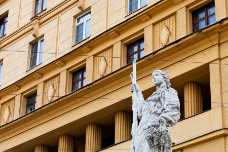 MOSCOW, RUSSIA - MAY 11: sculpture of woman with rifle of 30th years of 20th century on constructionism style house in Moscow, Russia on May 11, 2013. The house was built in 1936-1941 years.のeditorial素材