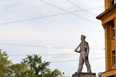 MOSCOW, RUSSIA - MAY 11: sculpture of working man of 30th years of 20th century on constructionism style house in Moscow, Russia on May 11, 2013. The house was built in 1936-1941 years.のeditorial素材