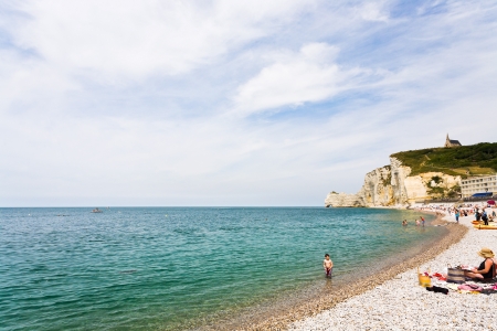 ETRETAT, FRANCE - JULY 1: beach and arch cliff near Etretat in France on July 1, 2010. The coast of Cote d'Albatre near Etretat is known by cliffs including three natural arches and pointed "needle"のeditorial素材