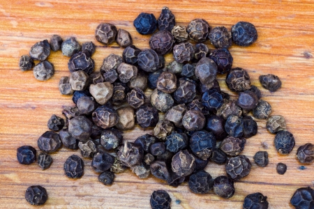 handful of black pepper peppercornsの写真素材