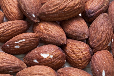 many nuts of sweet almonds close upの写真素材