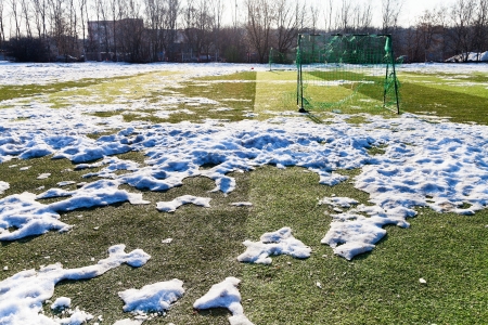 snow bound outdoors soccer field in low seasonの写真素材