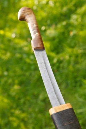 cossack saber unsheathing from wooden sheath