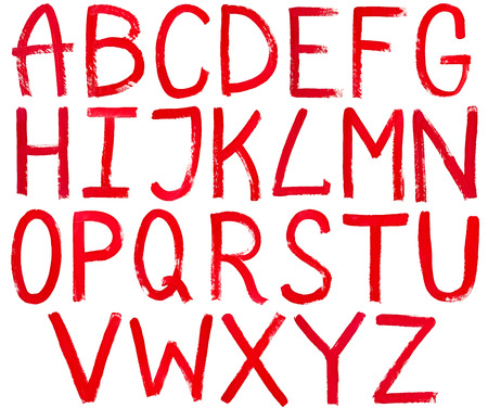 set of english capital letters hand written by red paint on white backgroundの写真素材