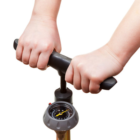 pumping by manual air pump with pressure indicator isolated on white backgroundの写真素材