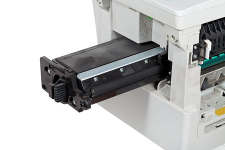 insert of toner cartridge in office multifunctional device close up