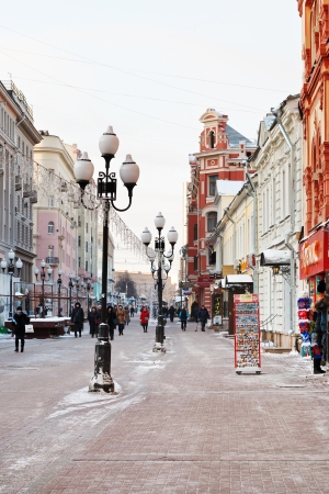 MOSCOW, RUSSIA - JANUARY 19, 2014: tourists , souvenir shops on Arbat street in Moscow. Arbat has existed since 15th century, it is pedestrian street about one km long in historical centre of Moscowのeditorial素材