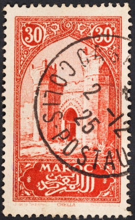 FRENCH MOROCCO - CIRCA 1923: A postage stamp printed in the Morocco shows Chellah or Sala Colonia complex of ancient Roman Mauretania Tingitana and medieval ruins near Rabat, circa 1923のeditorial素材