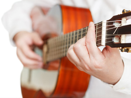 man playing classical guitar close up isolated on white background