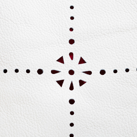 perforated pattern on white leather close upの写真素材