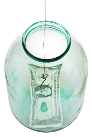 above view of fishing out last dollar from glass jar isolated on white background