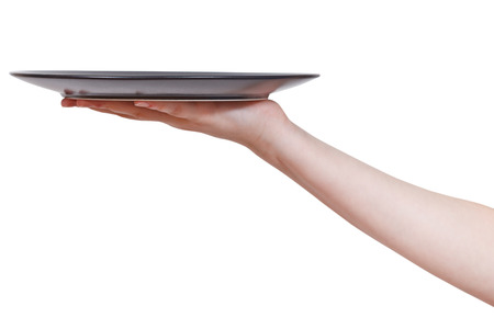 flat black plate on hand isolated on white backgroundの写真素材
