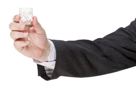 side view of vodka glass in male hand isolated on white backgroundの写真素材