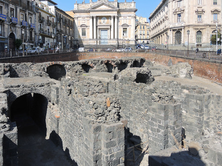 CATANIA, ITALY - AUGUST 10, 2013: ruins on ancient roman amphitheater on Piazza Stesicoro in Catania, Sicily. The arena dates from the 2nd century ADのeditorial素材