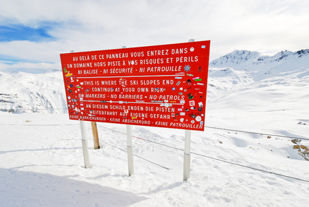 VAL D'ISERE, FRANCE - MARCH 14, 2011 - this is where the ski slopes end billboard in Paradiski region. Paradiski is skiing area in the Tarentaise Valley, France.のeditorial素材